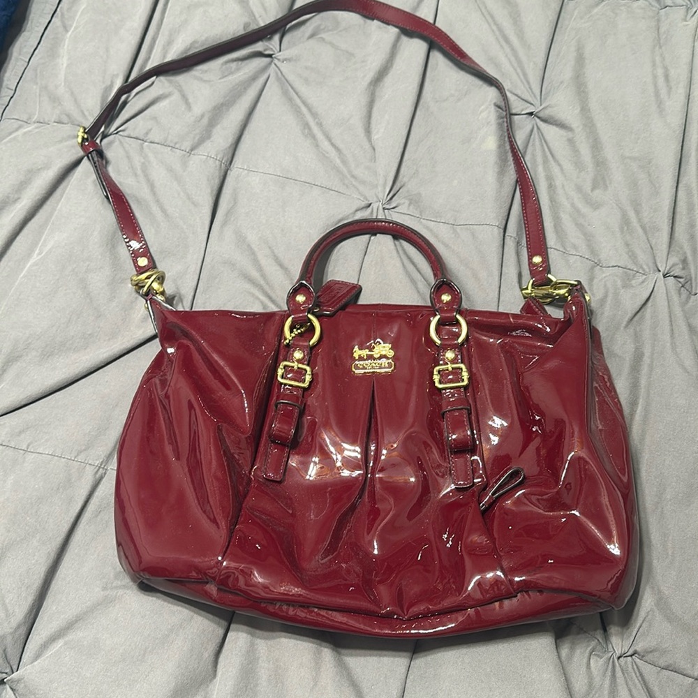 Burgundy patent leather with gold trim
 brand new
No scuffs or stains